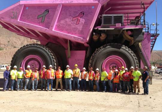 Women in Mining Pink Giant Haul truck and workers of varied genders